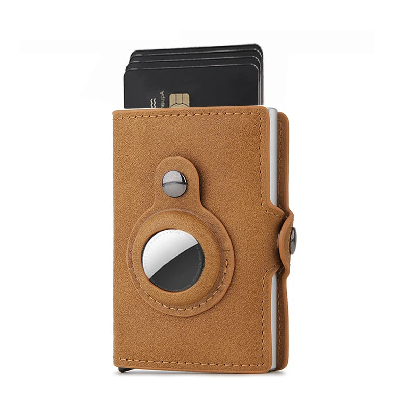 Brown leather cardholder with metallic accent on a white background